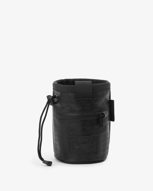 So iLL and On The Roam collaboration black wolf chalk bag with waist belt and cinch closure, designed by Jason Momoa. Back view on grey background.