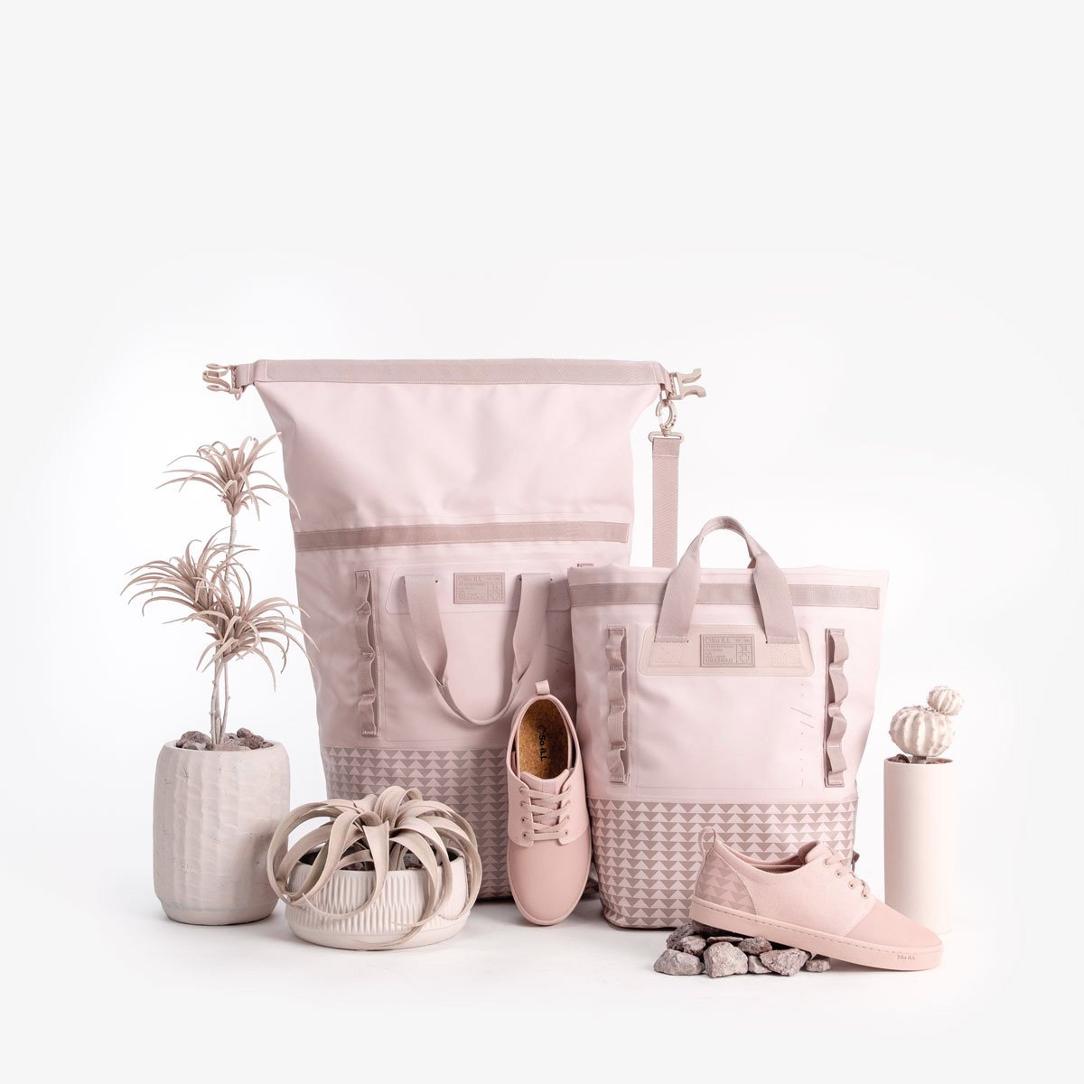 The so ill x on the roam dirty pink dirtbags and winos are shown with other pink props on a grey background