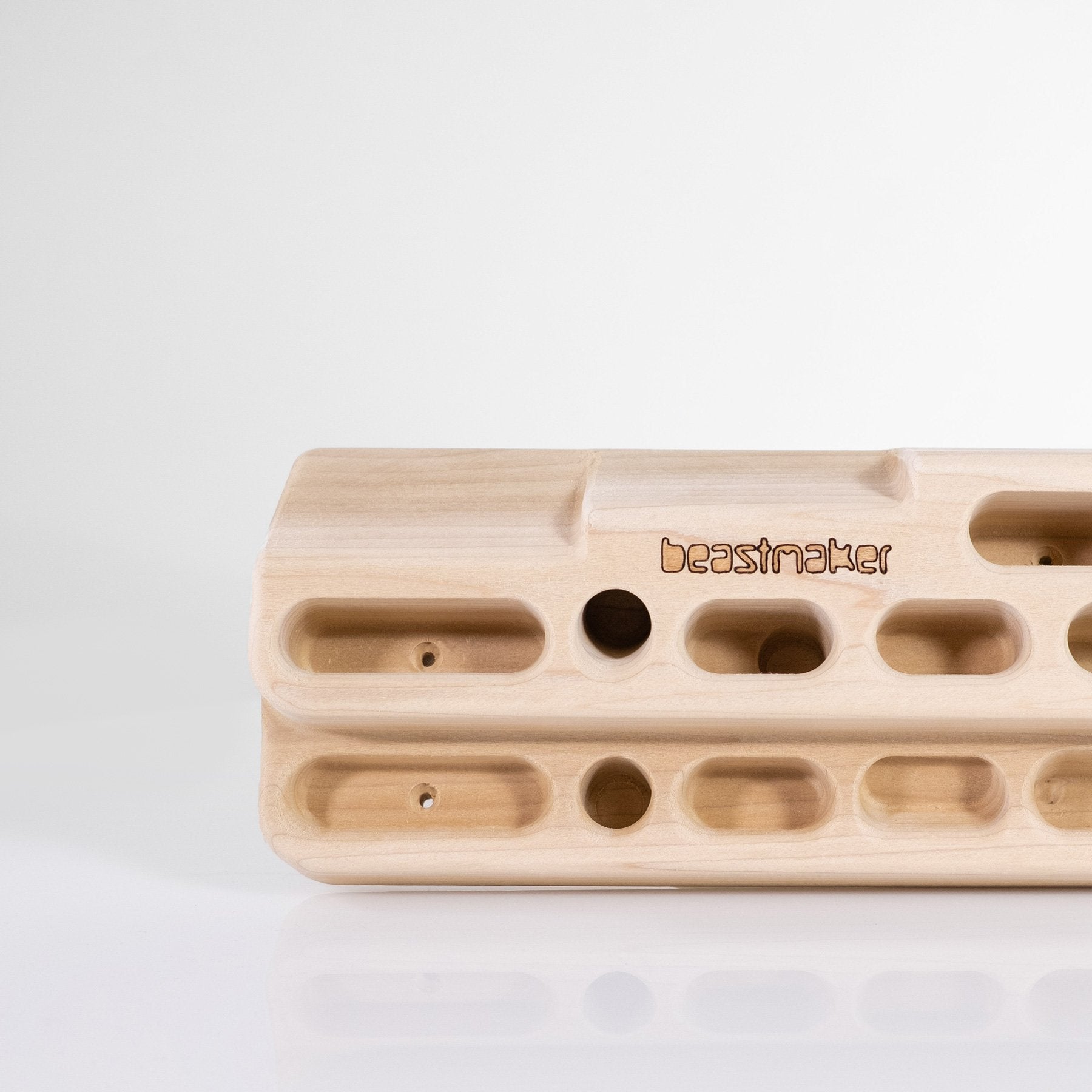 close up of So iLL distribution Beastmaker 2000 wooden climbing hangboard left side