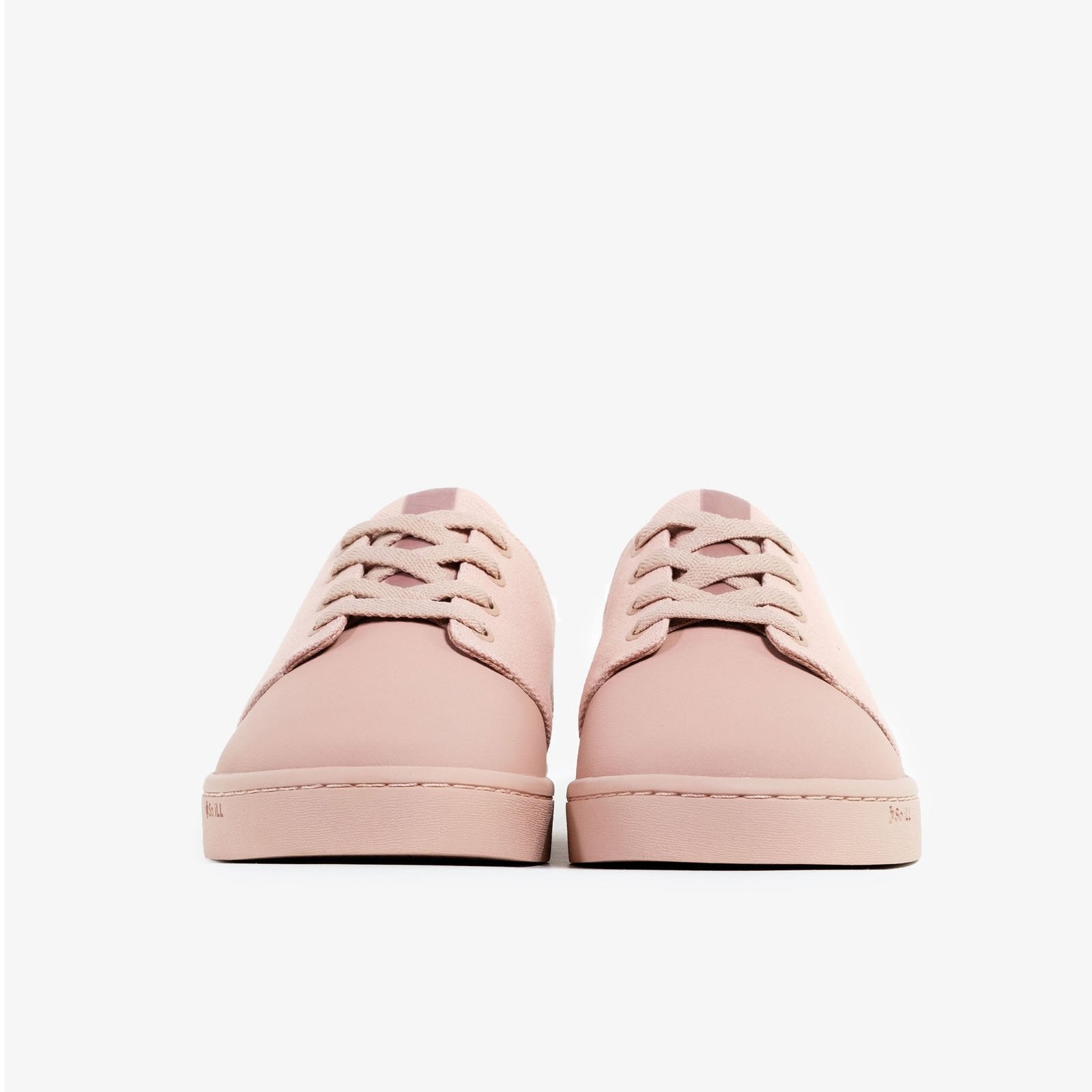 the so ill x on the roam dirty pink winos, designed by jason momoa are shown on a grey background right next to each other with the toes facing forward