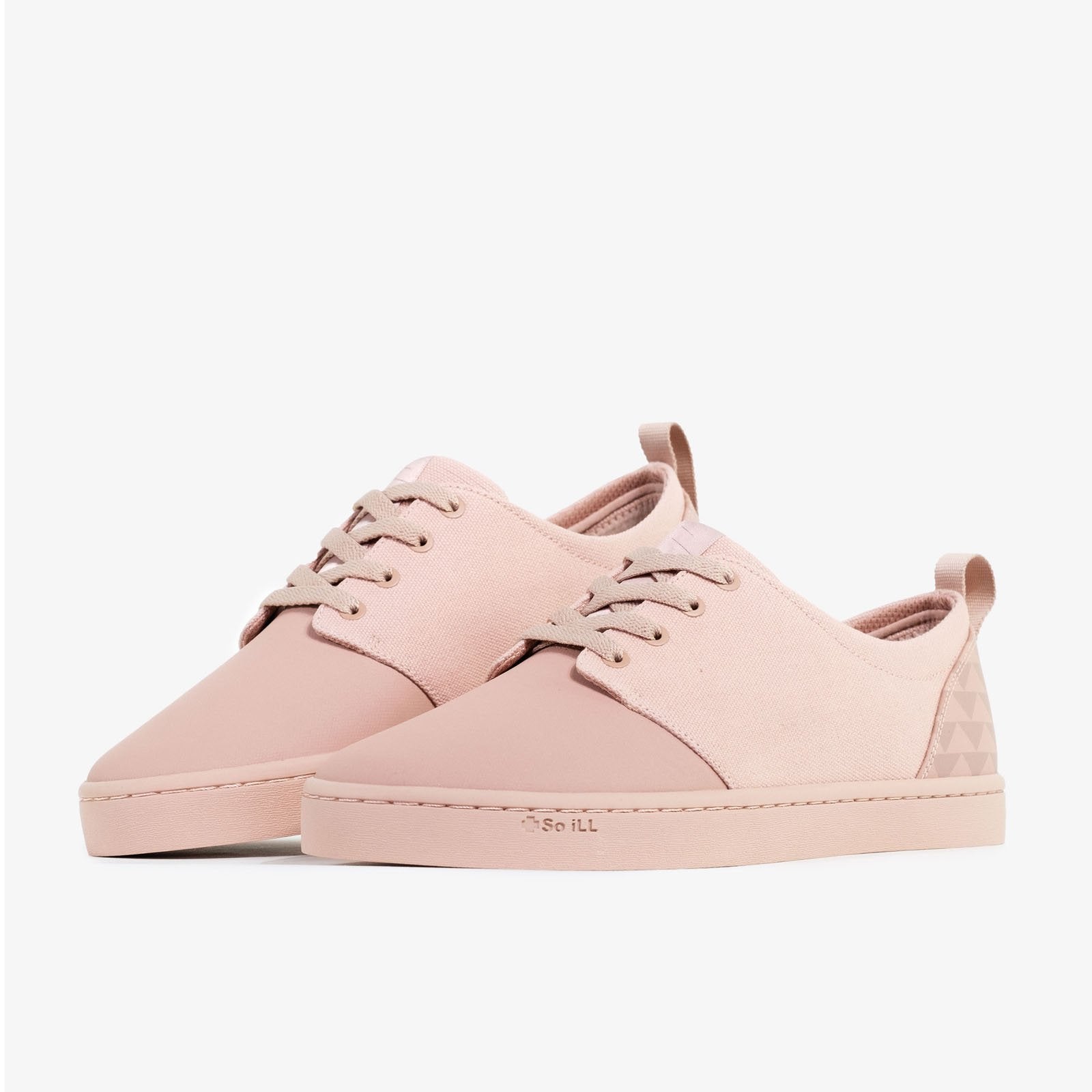 the so ill x on the roam dirty pink winos, designed by jason momoa are shown on a grey background with one shoe slightly behind the other and angle up on its toe
