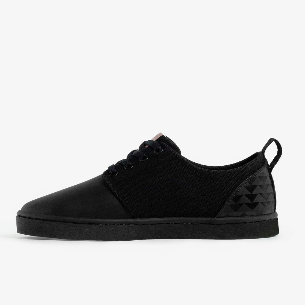 the instep of the so ill x on the roam black wolf wino, designed by jason momoa is on a grey background