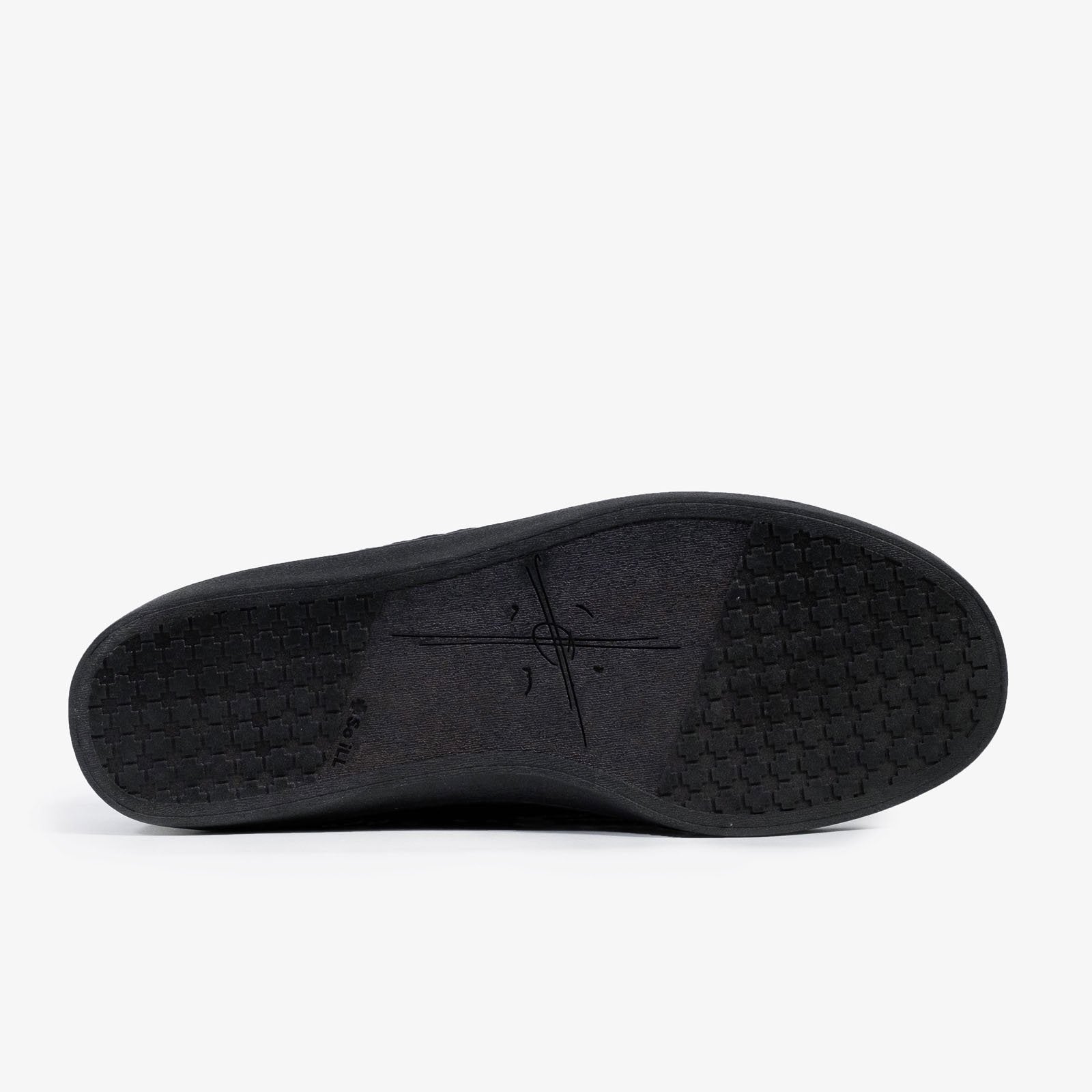 the so ill x on the roam black wolf wino, designed by jason momoa is shown on a grey background with the rubber sole of the shoe facing the camera