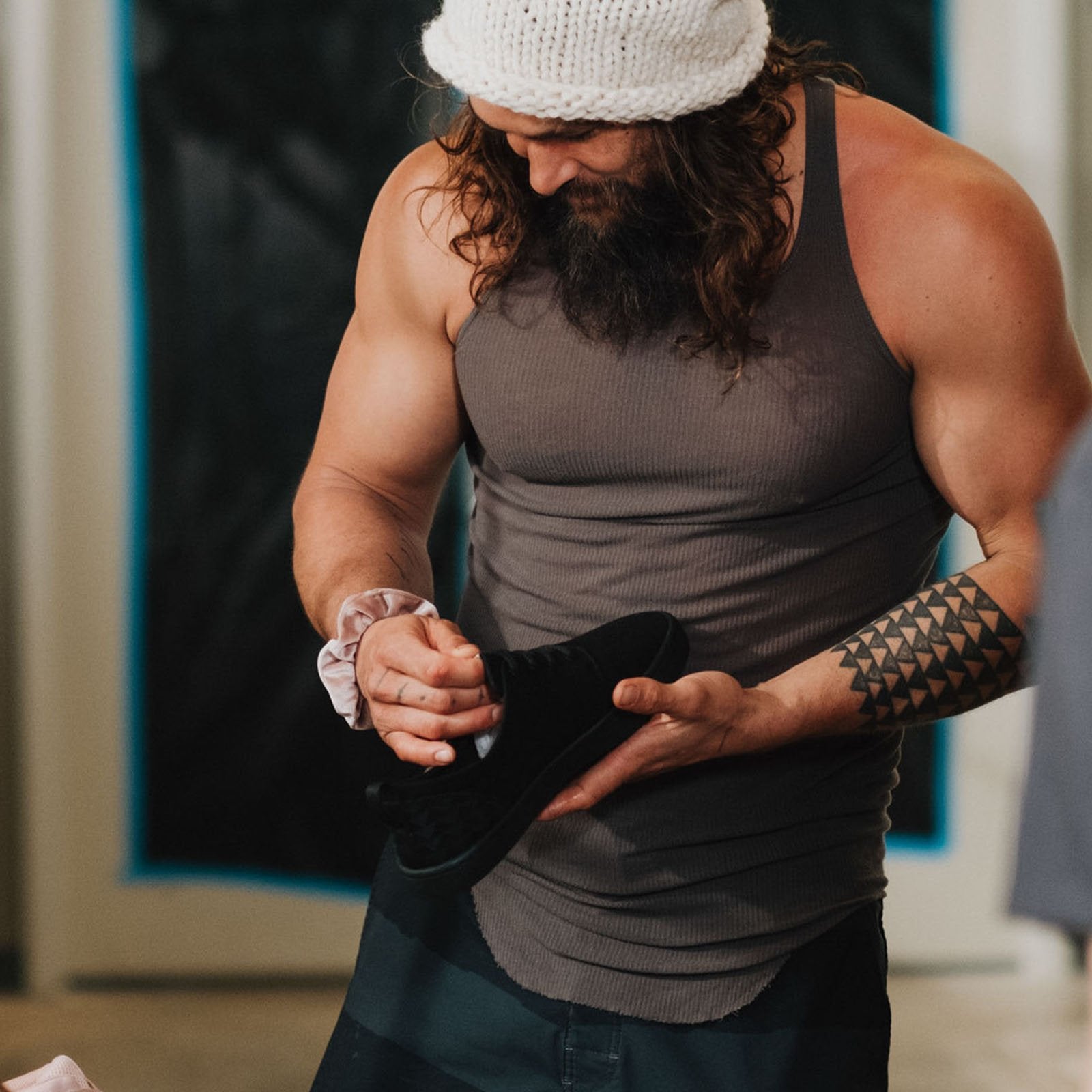 Jason momoa is shown examining his on the roam x so ill lifestyle shoes