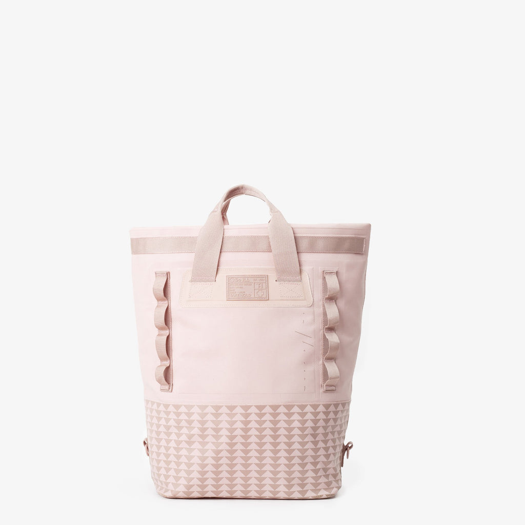 25L dirty pink so ill x on the roam dirt bag is shown rolled down into a tote and from the front