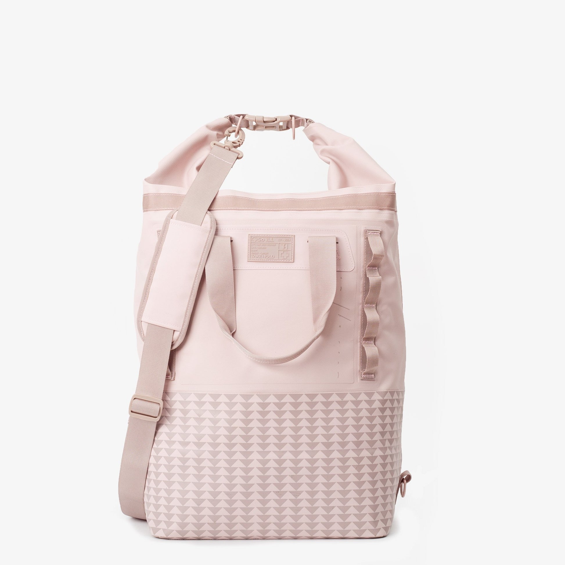 the 45L dirty pink so ill x on the roam dirt bag is shown rolled down to be water resistant