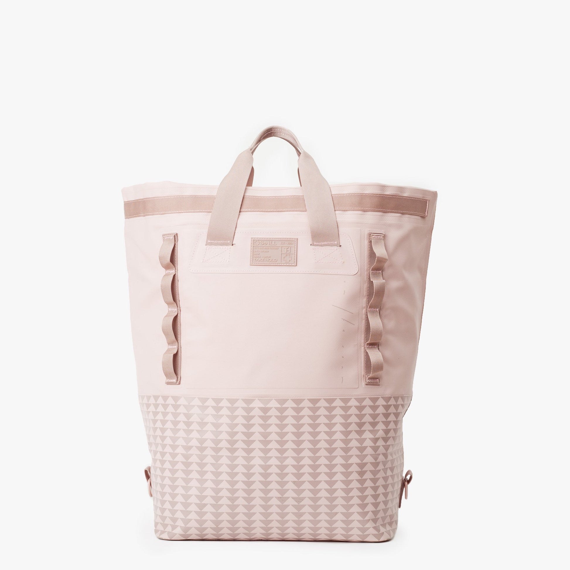 the 45L dirty pink so ill x on the roam dirt bag is shown rolled down to be carried as a tote